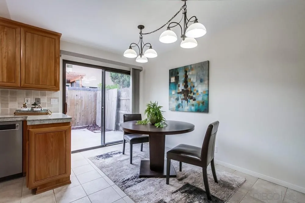 8918 Fletcher Valley Dr. Santee, CA 92071 - Photo 8 of 31 a view of a dining room with furniture window and wooden floor