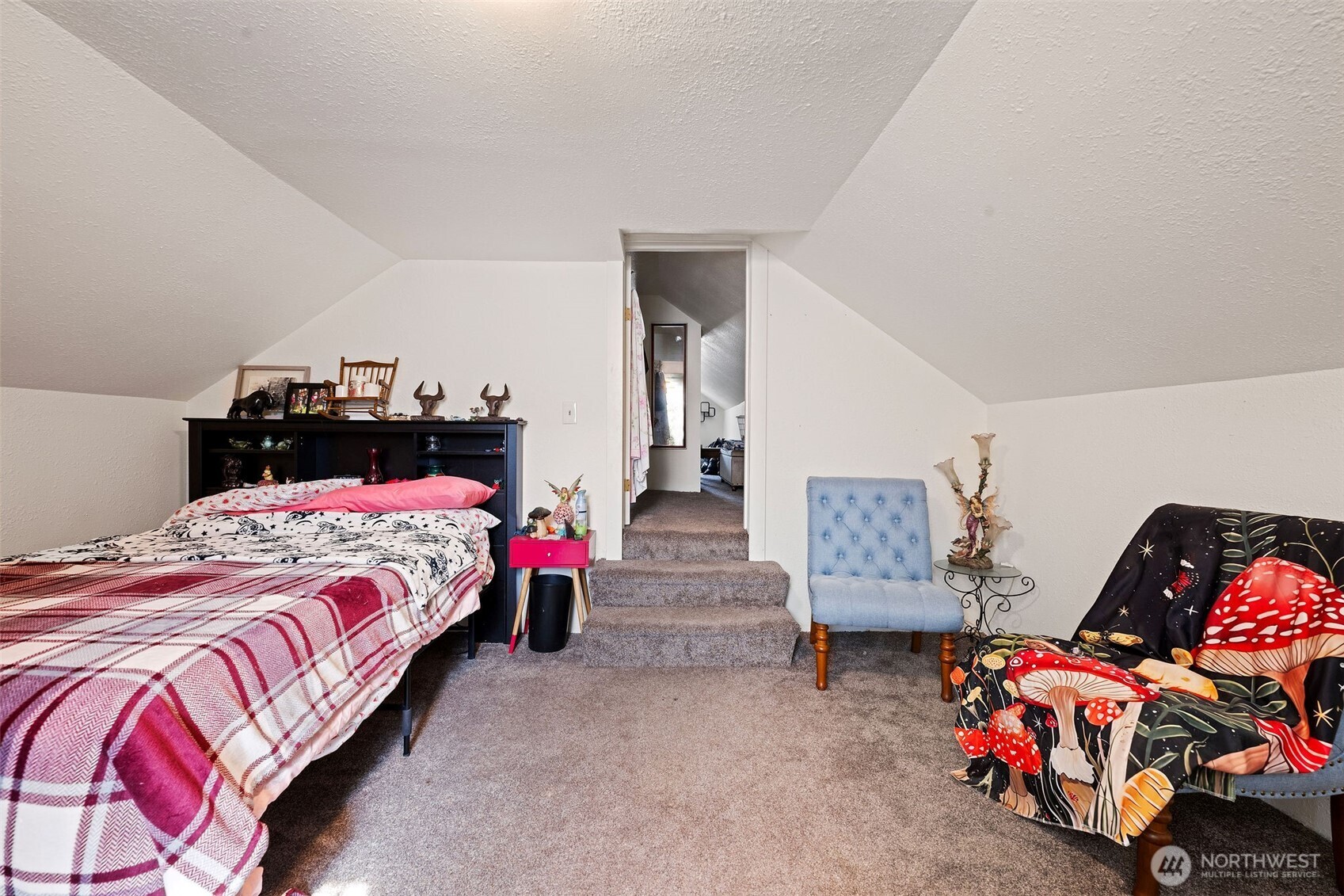 1218 Cedar Street Raymond, WA 98577 - Photo 24 of 31 a bedroom with a bed and a couch