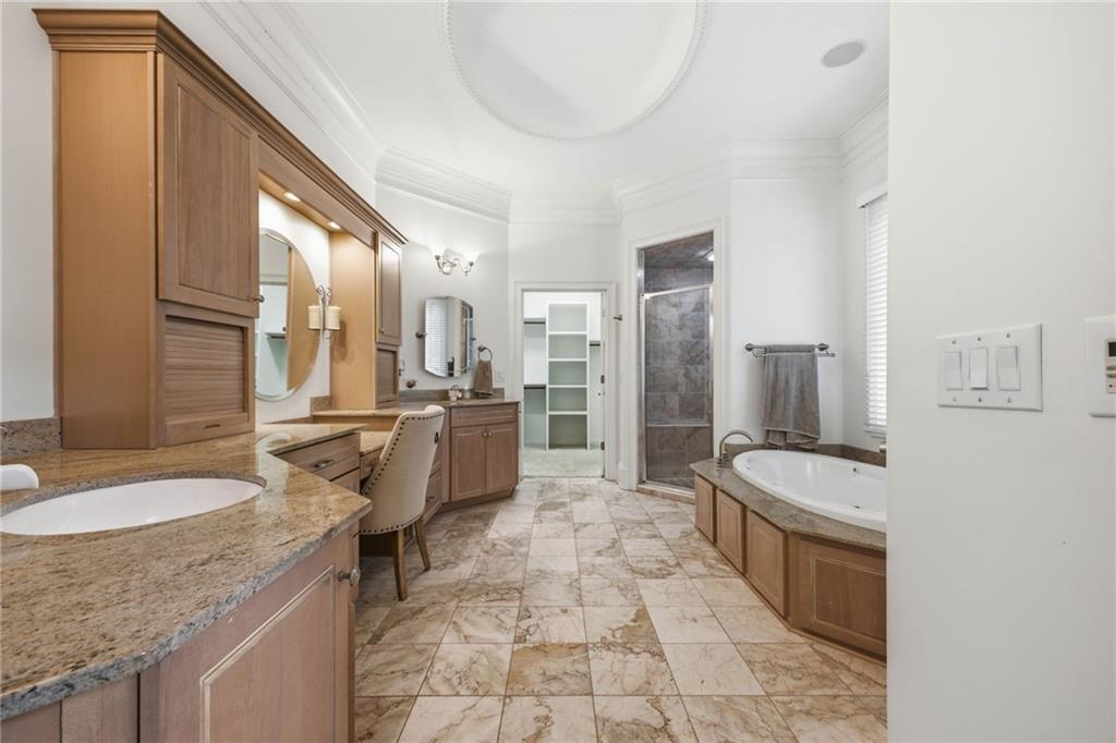 5 St Andrews Way Rome, GA 30165 - Photo 35 of 75 a bathroom with a granite countertop sink a toilet a mirror and bathtub