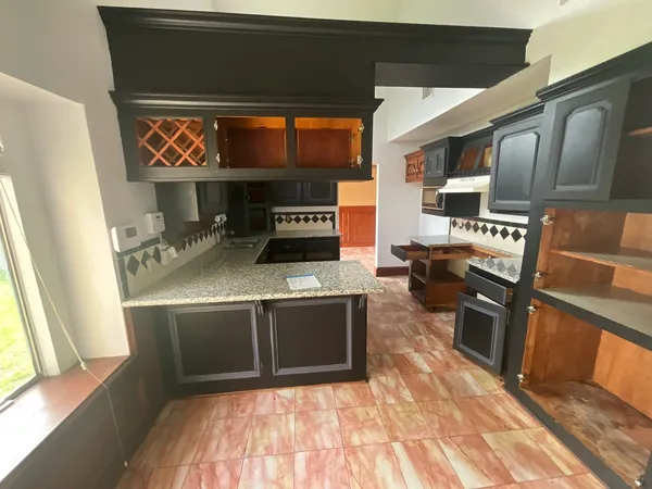 a kitchen with stainless steel appliances granite countertop a stove and a sink