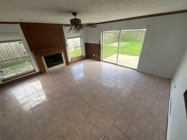 a view of livingroom with furniture and a fireplace