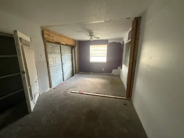 a view of empty room with windows