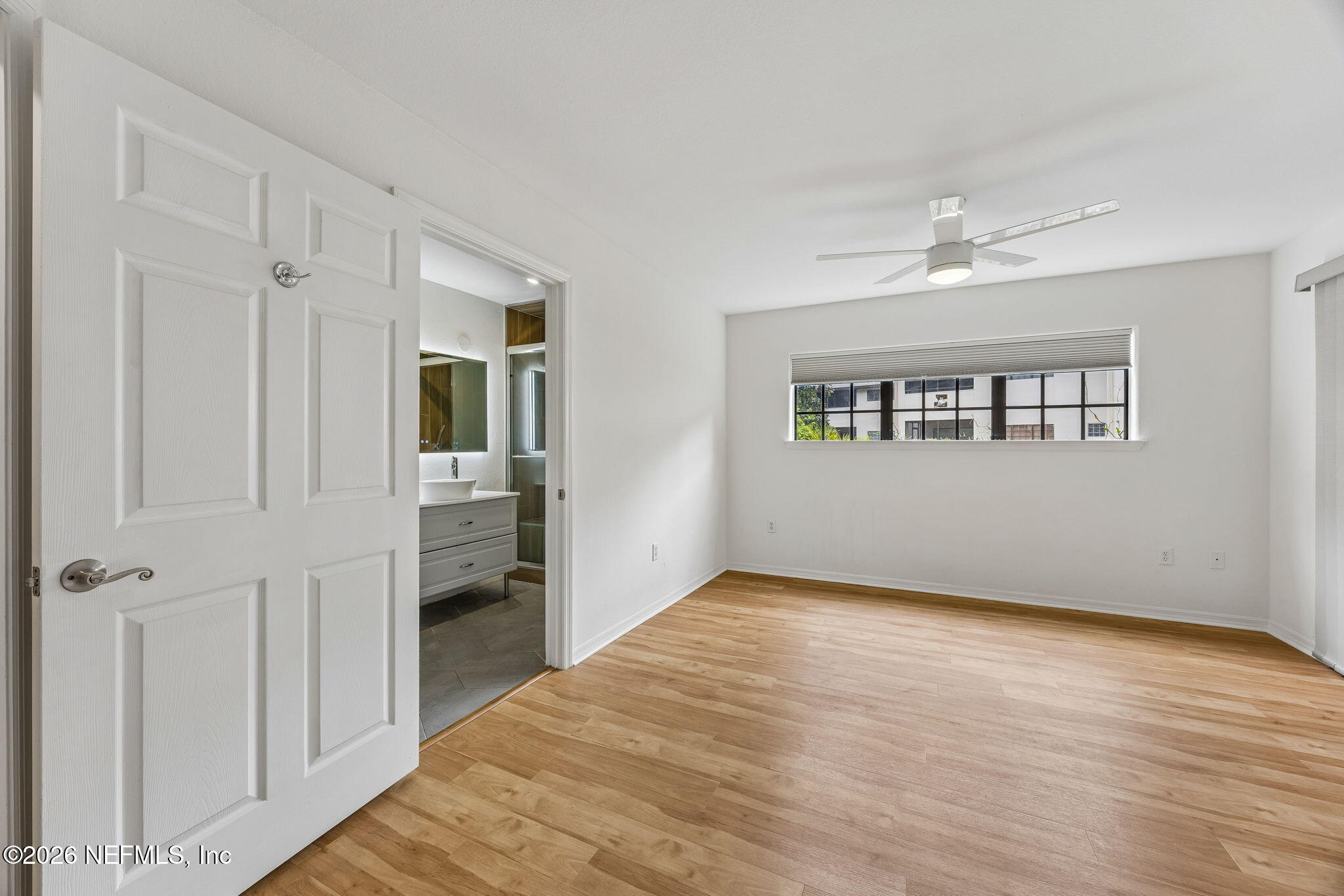 10150 Belle Rive Boulevard, Unit 1109 Jacksonville, FL 32256 - Photo 13 of 55 a view of an empty room with a window