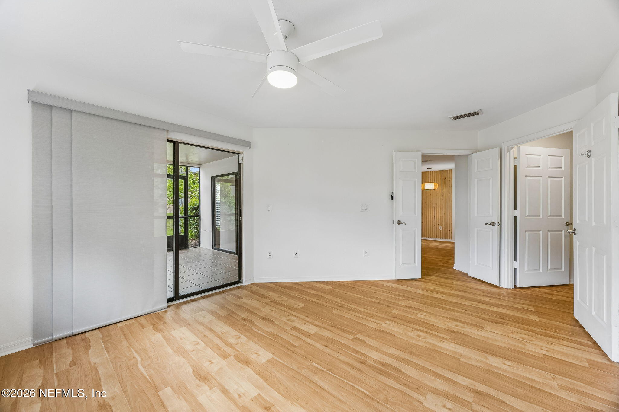 10150 Belle Rive Boulevard, Unit 1109 Jacksonville, FL 32256 - Photo 16 of 55 a bedroom with a bed and a window