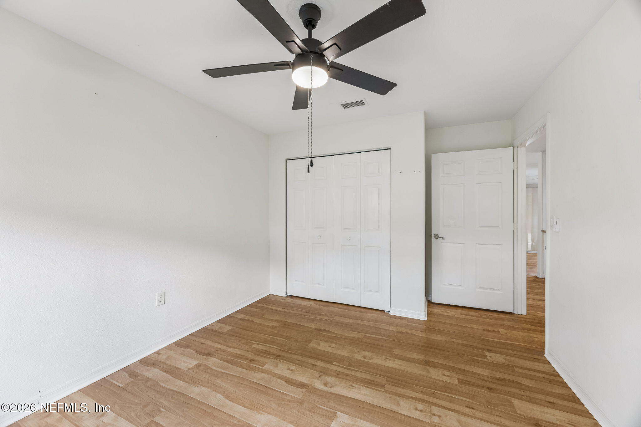 10150 Belle Rive Boulevard, Unit 1109 Jacksonville, FL 32256 - Photo 20 of 55 a view of empty room with wooden floor