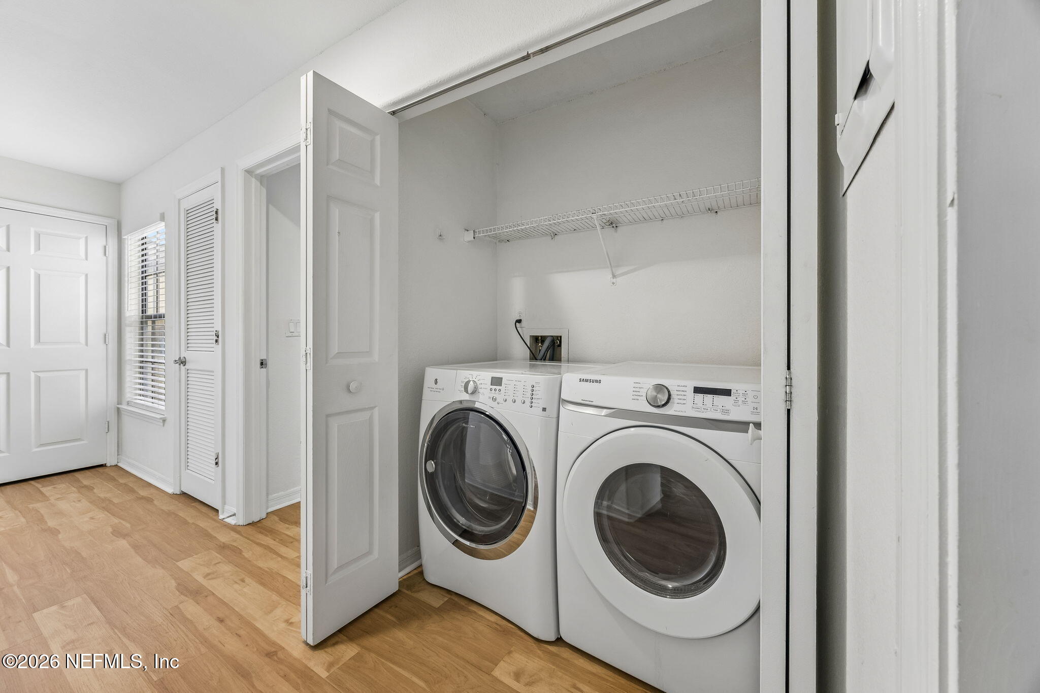 10150 Belle Rive Boulevard, Unit 1109 Jacksonville, FL 32256 - Photo 21 of 55 a utility room with dryer and washer