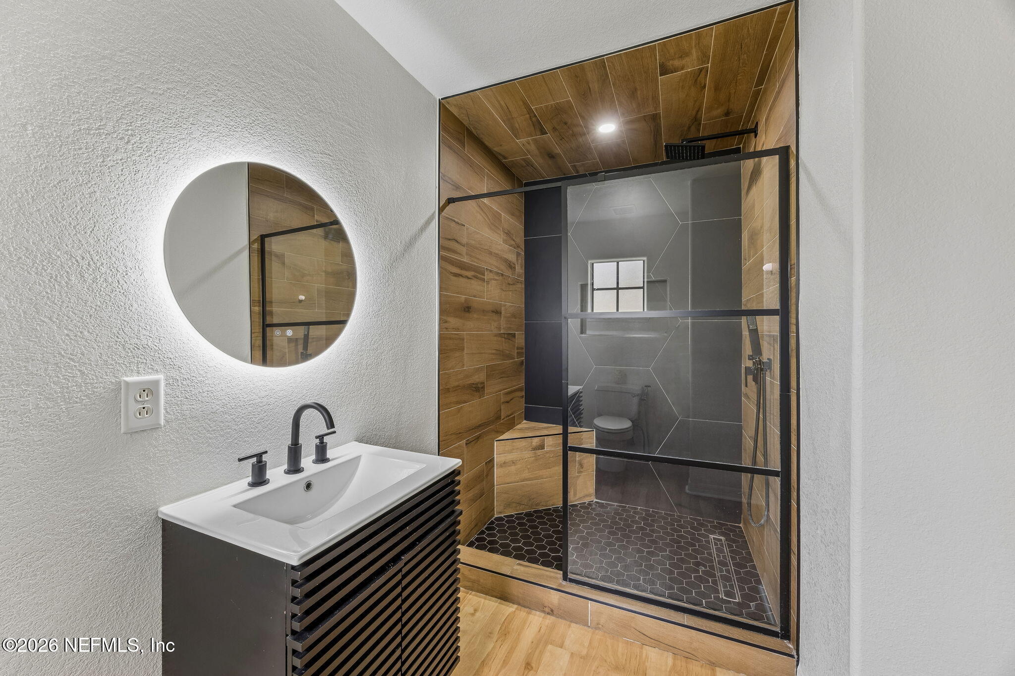 10150 Belle Rive Boulevard, Unit 1109 Jacksonville, FL 32256 - Photo 22 of 55 a bathroom with a sink and mirror