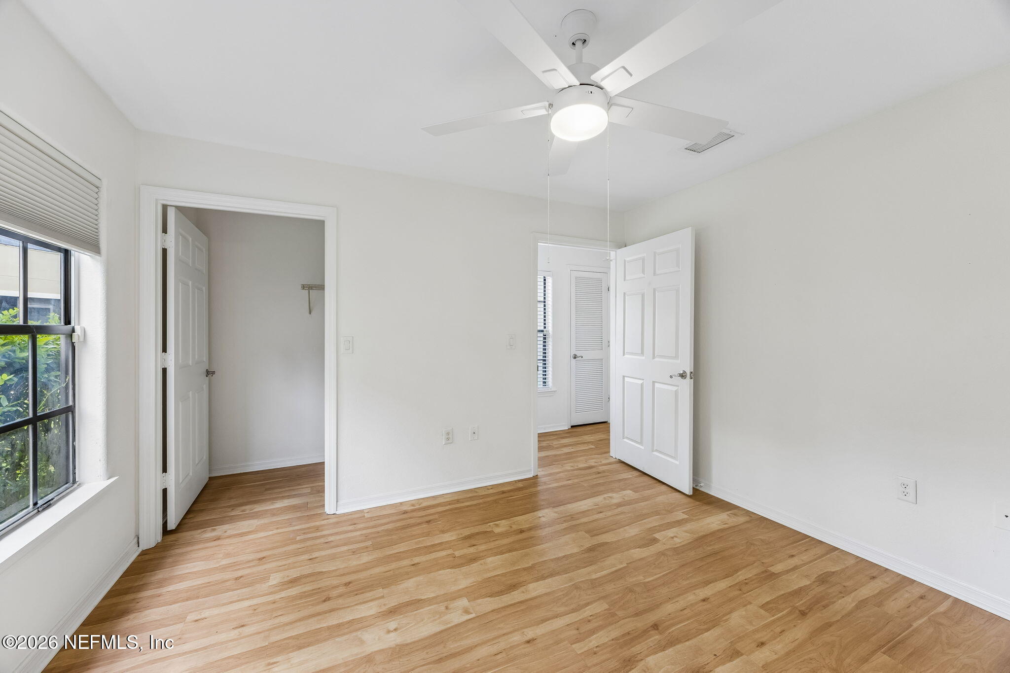 10150 Belle Rive Boulevard, Unit 1109 Jacksonville, FL 32256 - Photo 24 of 55 a view of an empty room with wooden floor