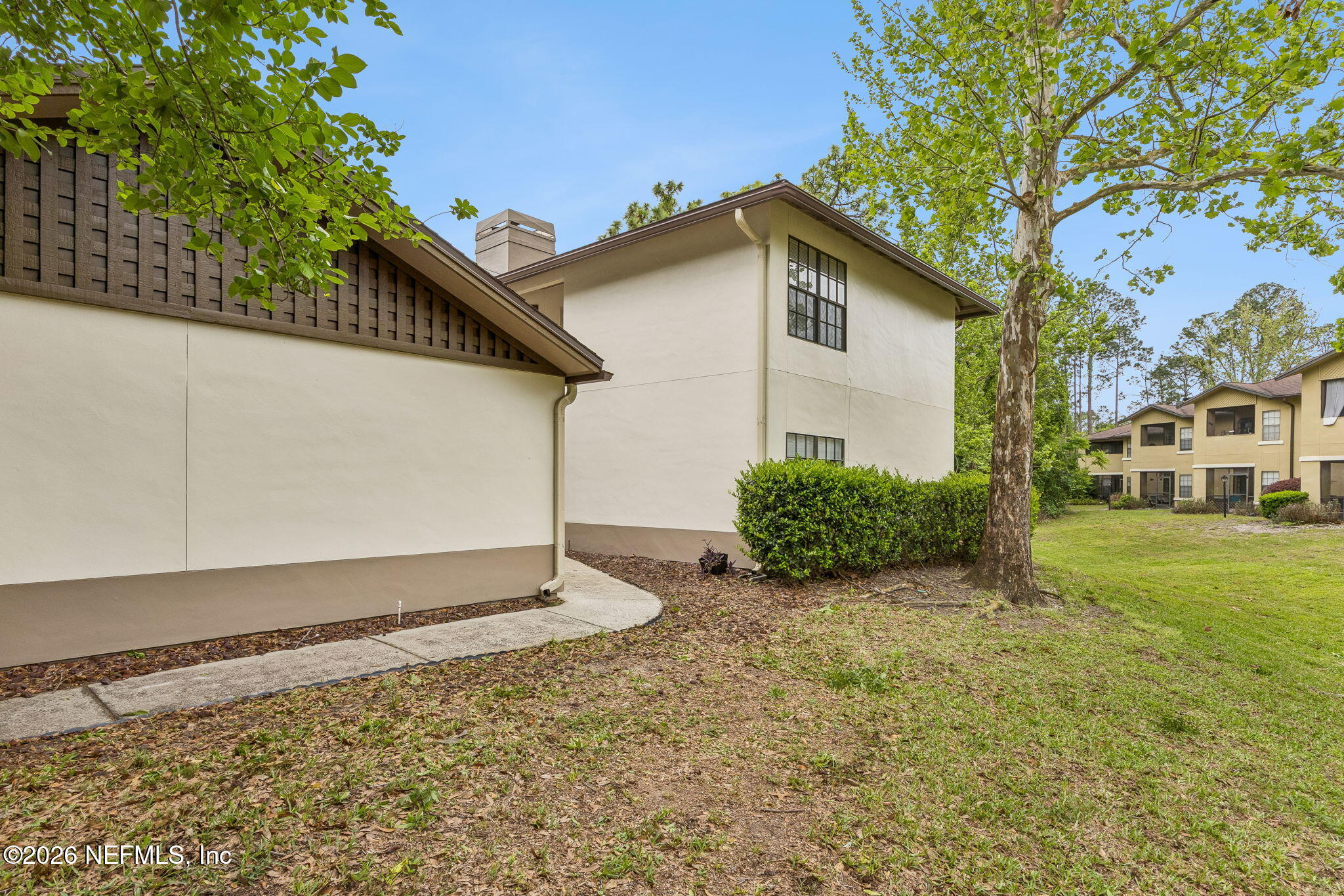 10150 Belle Rive Boulevard, Unit 1109 Jacksonville, FL 32256 - Photo 29 of 55 a view of a house with a yard