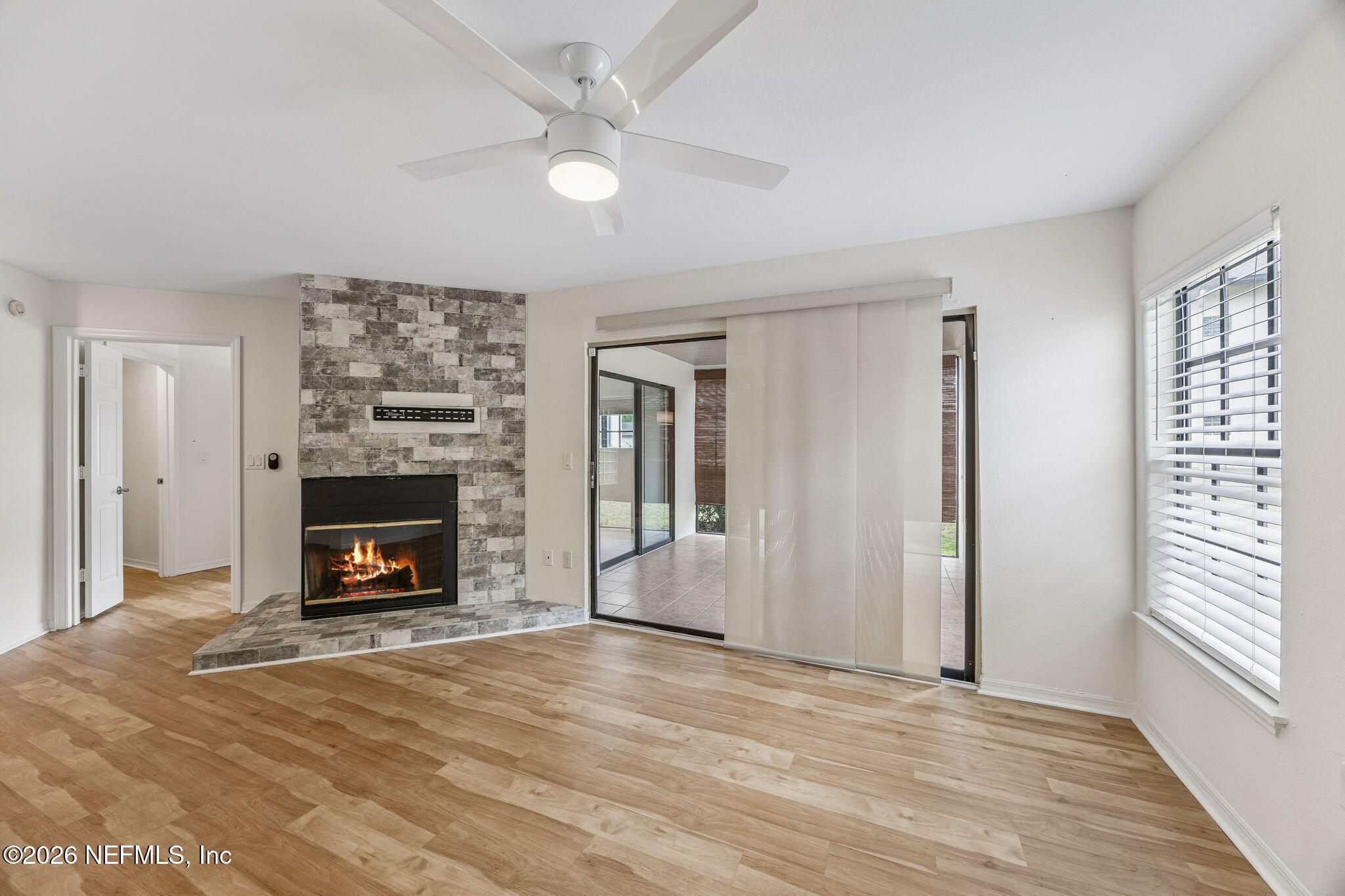 10150 Belle Rive Boulevard, Unit 1109 Jacksonville, FL 32256 - Photo 3 of 55 a view of a livingroom with a fireplace and window