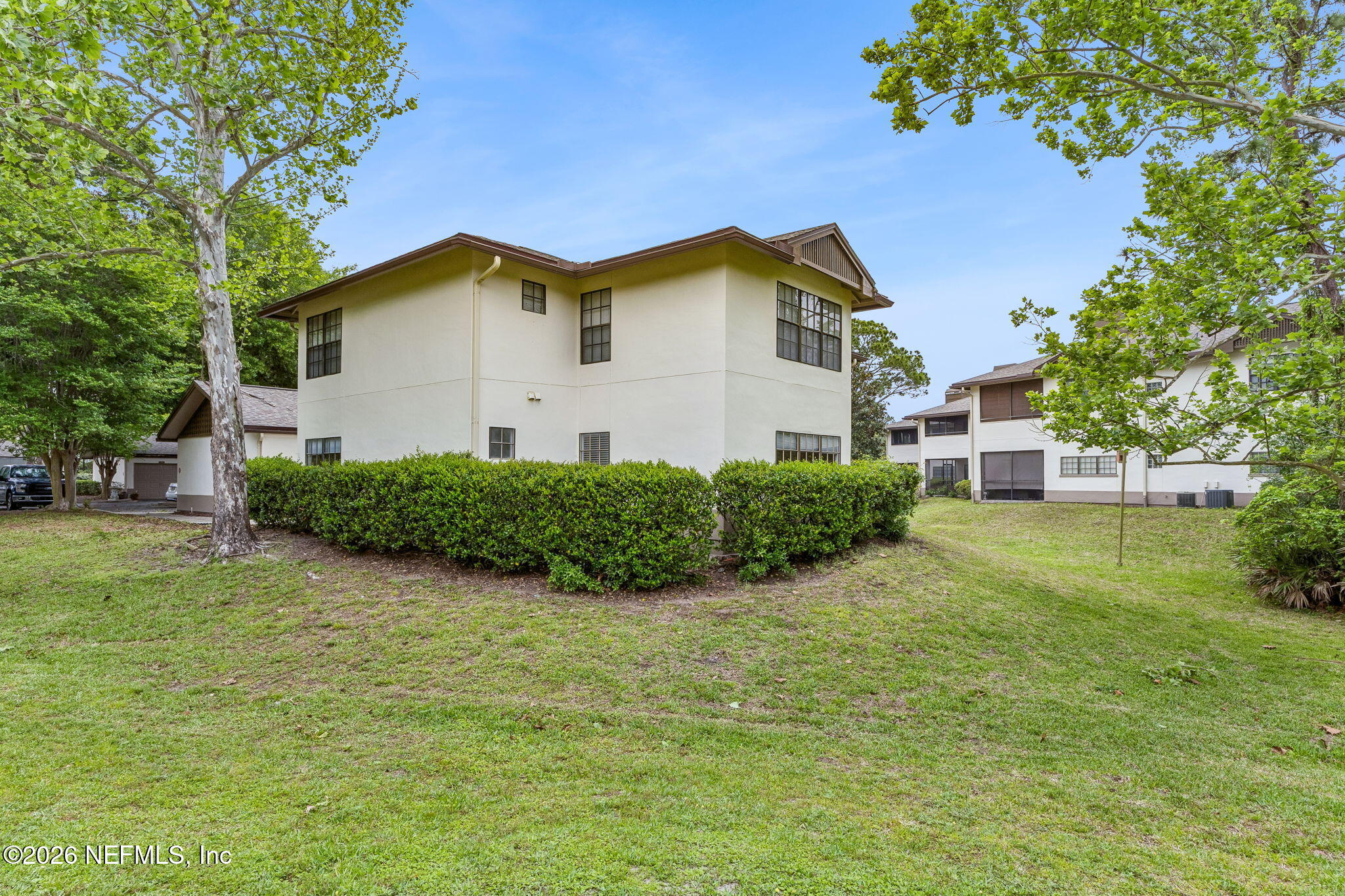 10150 Belle Rive Boulevard, Unit 1109 Jacksonville, FL 32256 - Photo 31 of 55 a view of a house with a yard