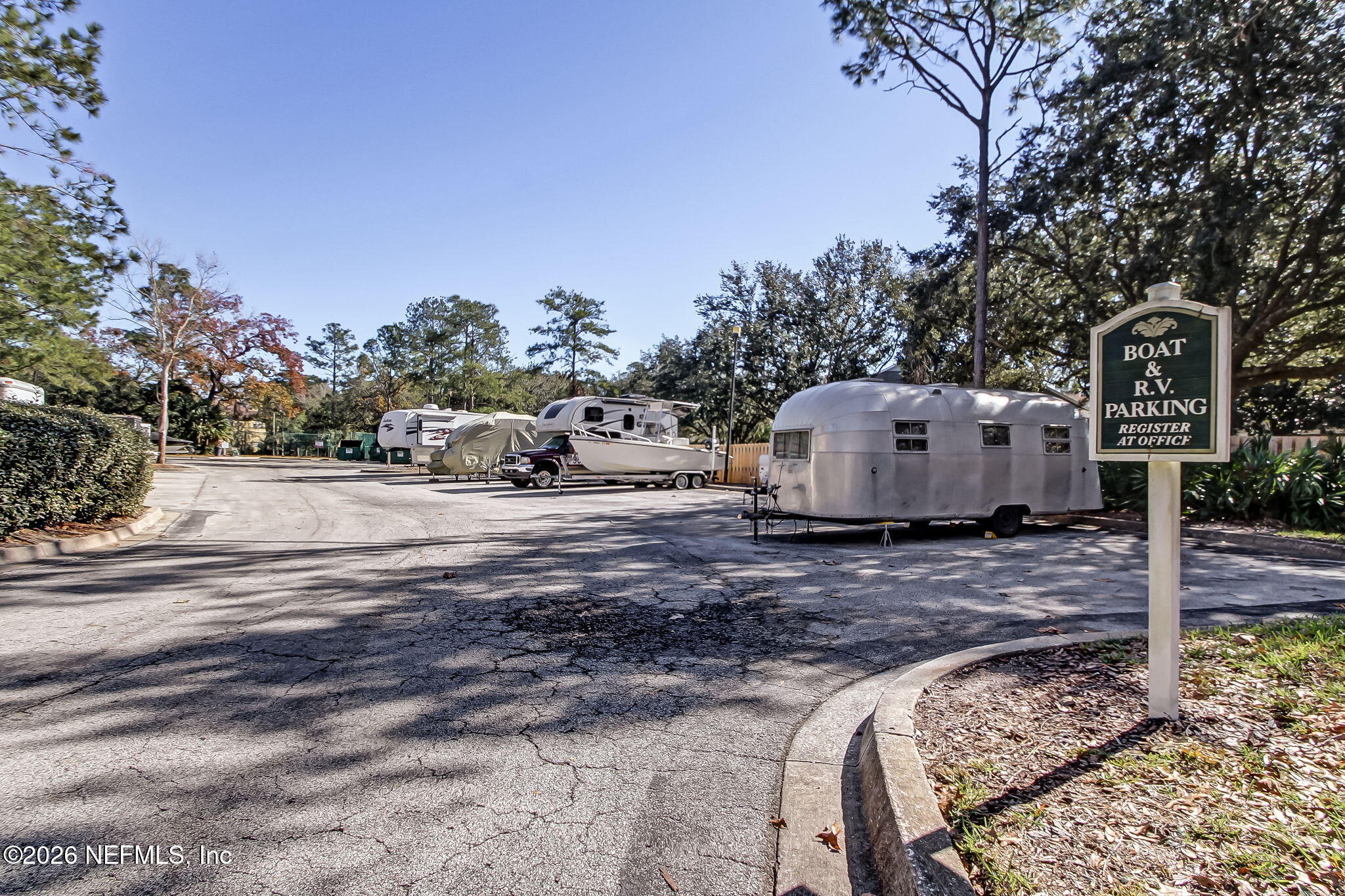 10150 Belle Rive Boulevard, Unit 1109 Jacksonville, FL 32256 - Photo 35 of 55 a view of a house with backyard and trees