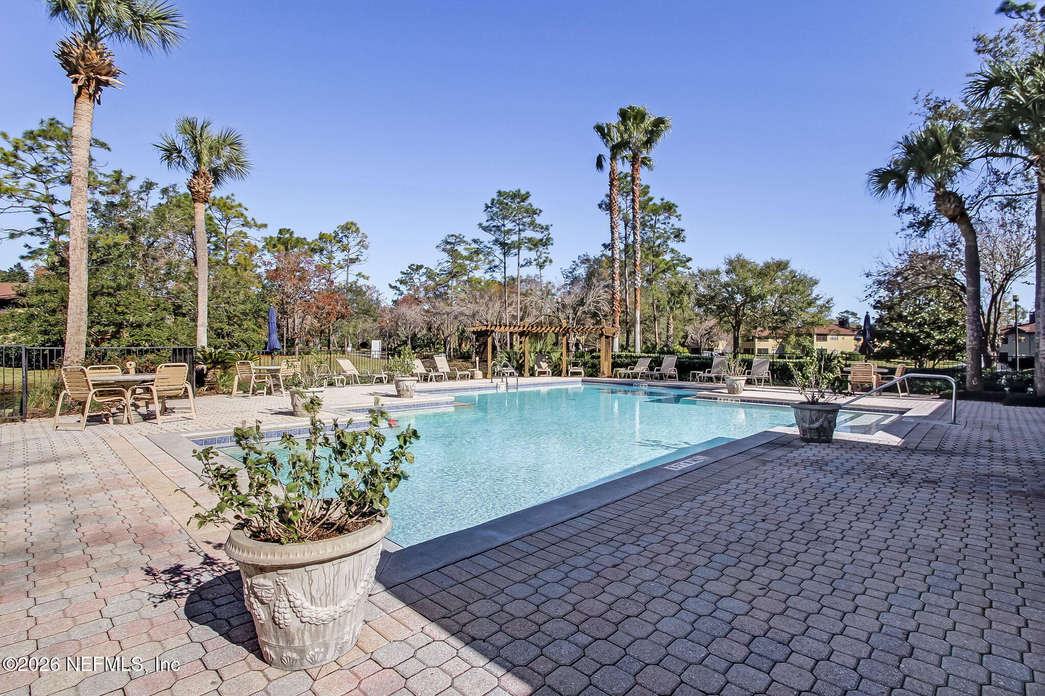 10150 Belle Rive Boulevard, Unit 1109 Jacksonville, FL 32256 - Photo 41 of 55 a view of a terrace with sitting area