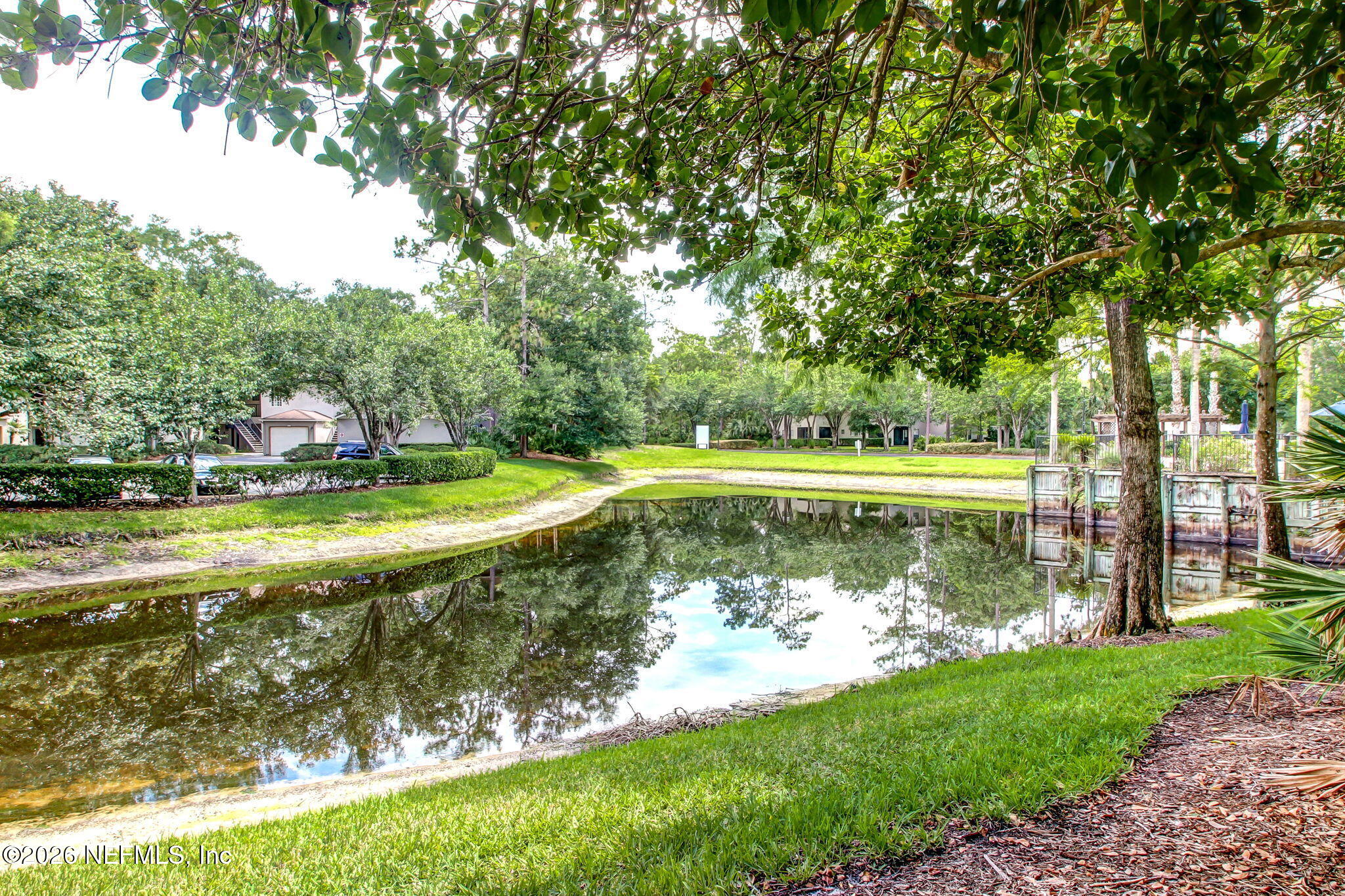 10150 Belle Rive Boulevard, Unit 1109 Jacksonville, FL 32256 - Photo 46 of 55 a view of a swimming pool with a yard