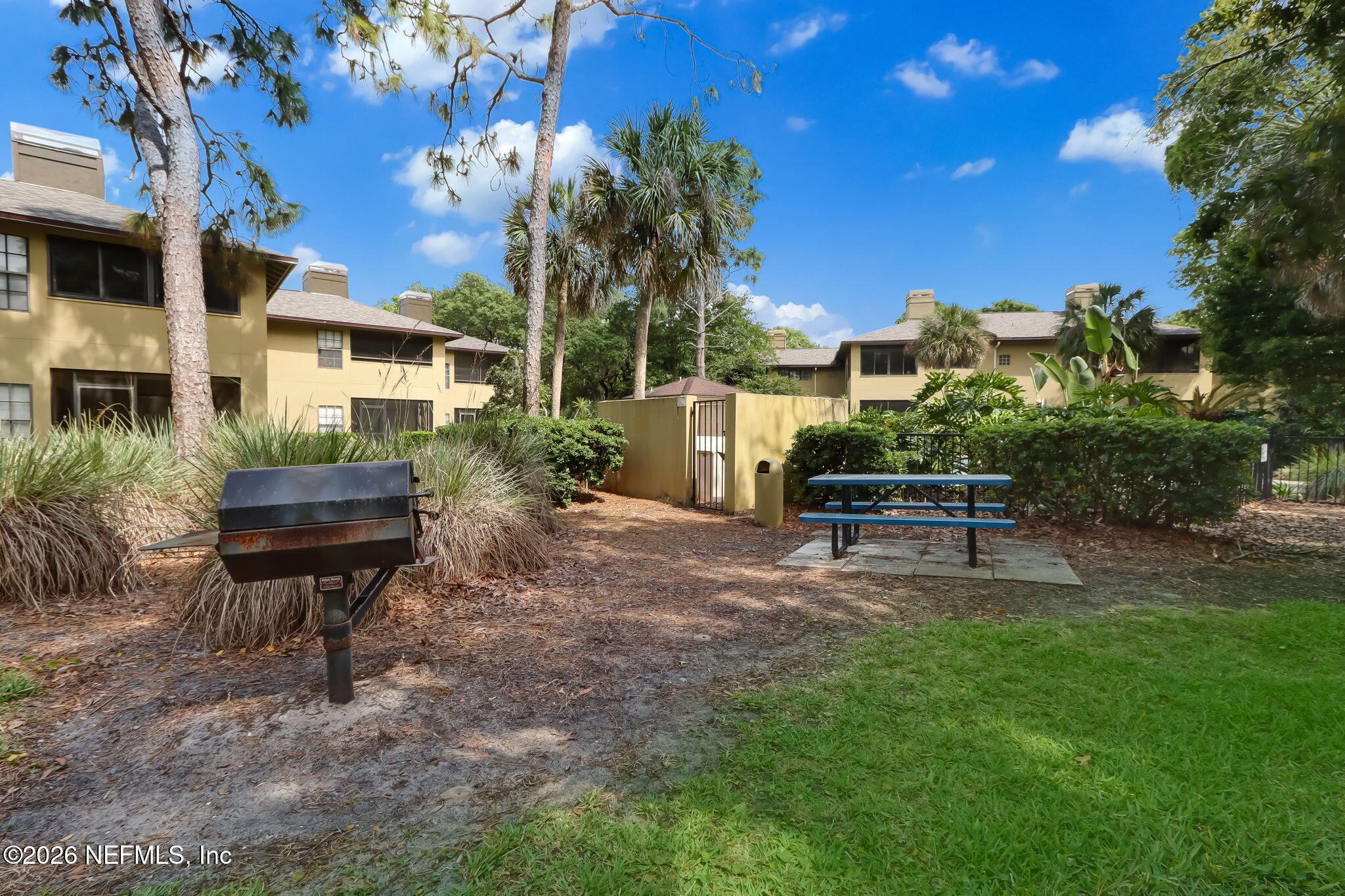 10150 Belle Rive Boulevard, Unit 1109 Jacksonville, FL 32256 - Photo 47 of 55 a house view with a sitting space and garden