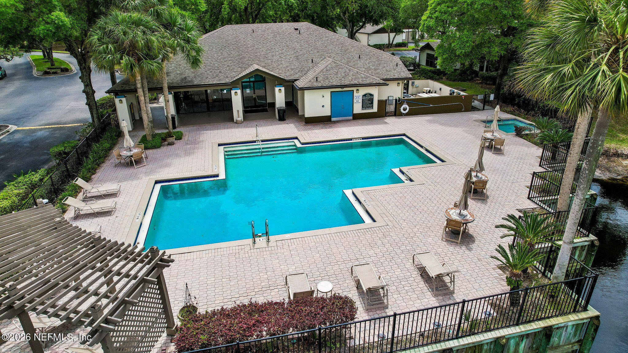 10150 Belle Rive Boulevard, Unit 1109 Jacksonville, FL 32256 - Photo 54 of 55 an aerial view of a house with swimming pool garden and patio