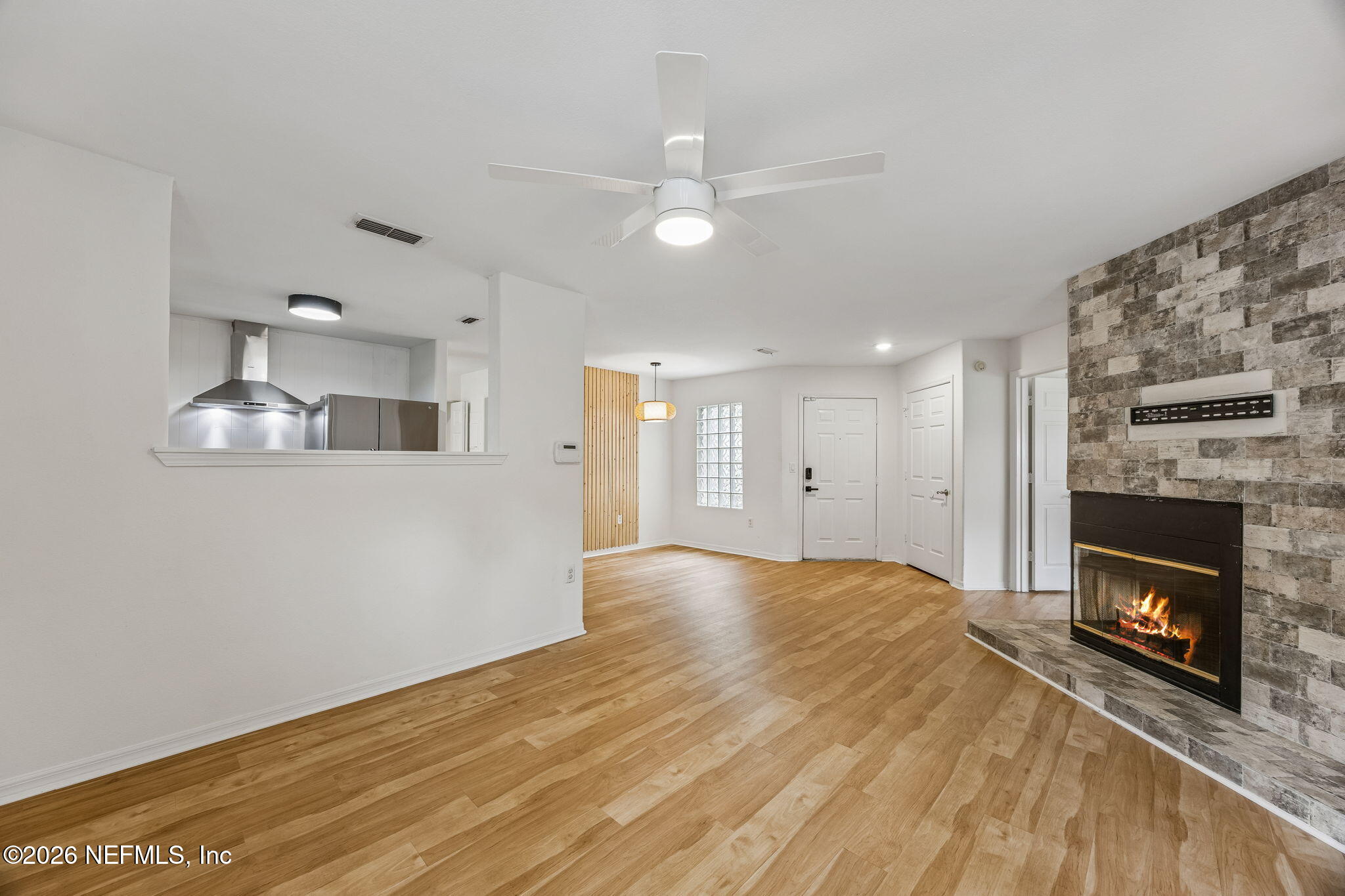 10150 Belle Rive Boulevard, Unit 1109 Jacksonville, FL 32256 - Photo 8 of 55 a view of an empty room with a fireplace