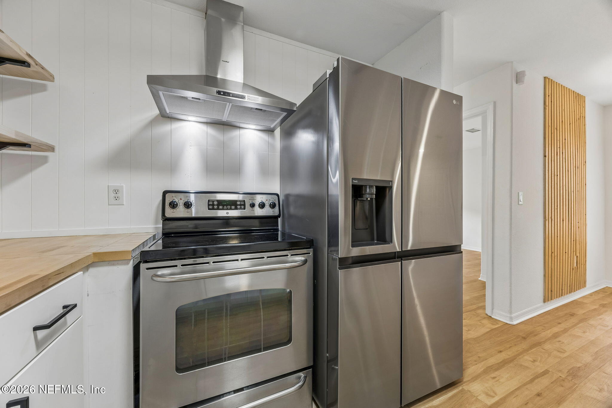 10150 Belle Rive Boulevard, Unit 1109 Jacksonville, FL 32256 - Photo 10 of 55 a kitchen with cabinets and stainless steel appliances