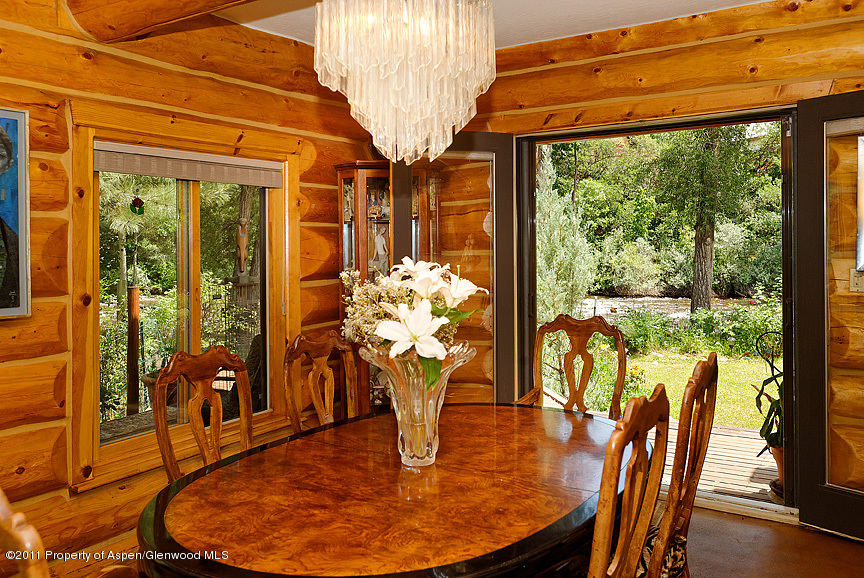 642 Frying Pan Road Basalt, CO 81621 - Photo 14 of 20 a view of a dining room with furniture a chandelier and wooden floor