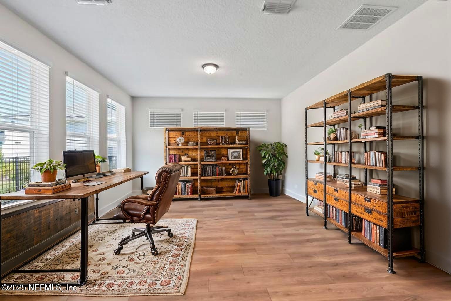 61 Oak Cluster Lane St. Augustine, FL 32092 - Photo 17 of 45 a view of a workspace with furniture and a window