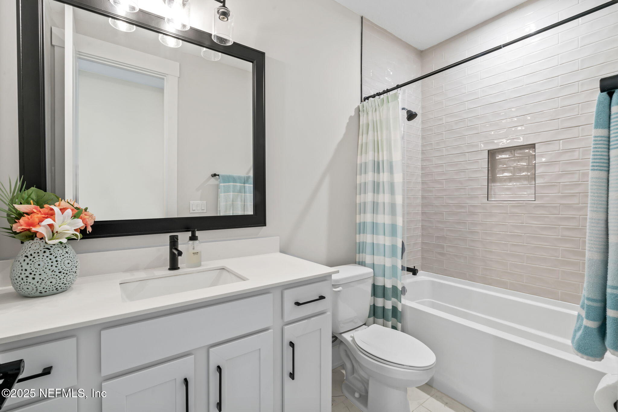 61 Oak Cluster Lane St. Augustine, FL 32092 - Photo 23 of 45 a bathroom with a sink a toilet and shower