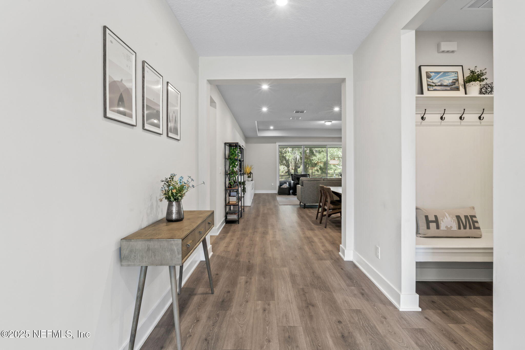 61 Oak Cluster Lane St. Augustine, FL 32092 - Photo 7 of 45 a view of a hallway view with wooden floor and furniture