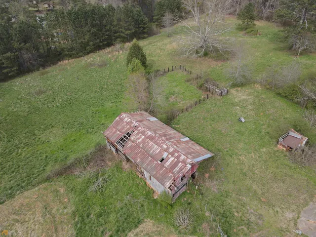 a aerial view of a house with a yard