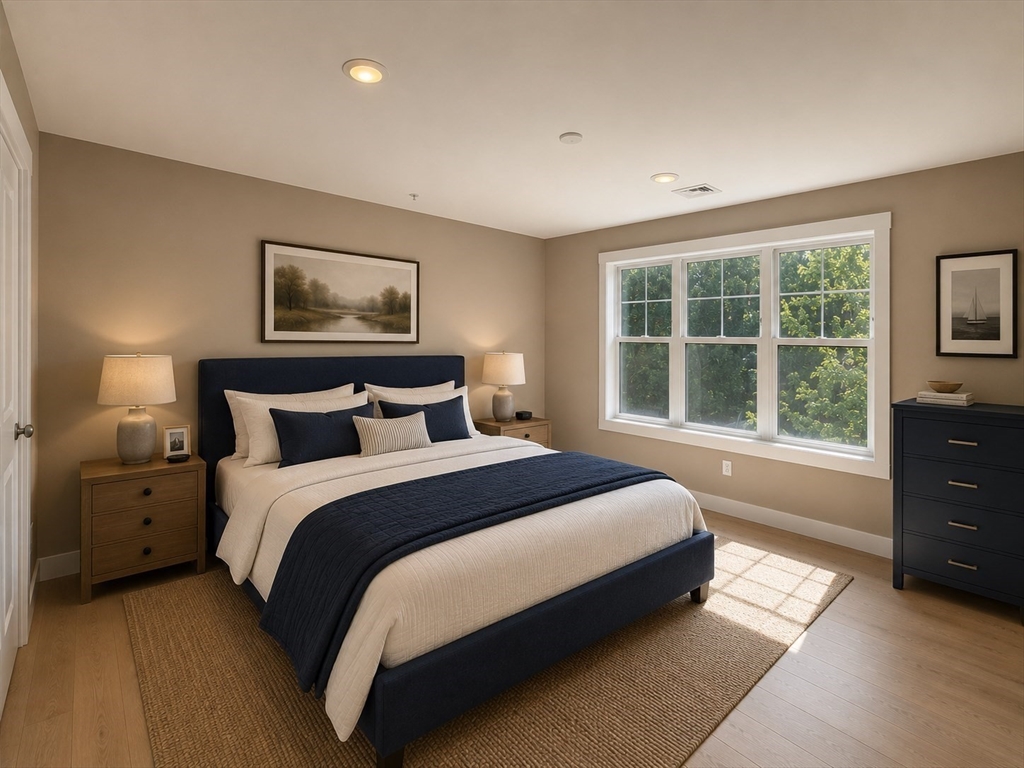 269 Main Street, Unit 2006 Reading, MA 01867 - Photo 7 of 10 a bedroom with a bed and a window