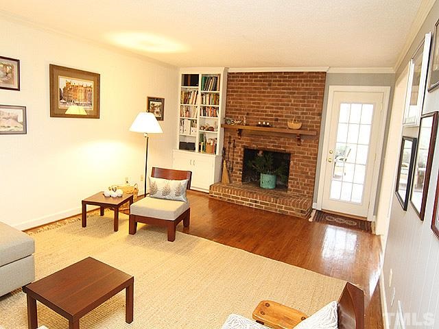 1605 Westhaven Drive Raleigh, NC 27607 - Photo 11 of 23 a living room with furniture and a fireplace