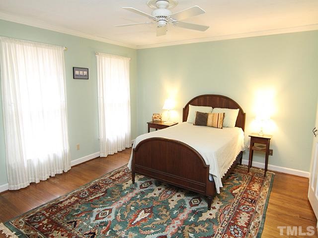 1605 Westhaven Drive Raleigh, NC 27607 - Photo 14 of 23 a bedroom with a bed and wooden floor