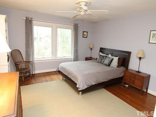 1605 Westhaven Drive Raleigh, NC 27607 - Photo 18 of 23 a bedroom with a bed chair and window