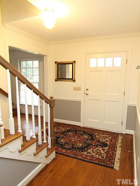 1605 Westhaven Drive Raleigh, NC 27607 - Photo 3 of 23 view of an empty room with wooden floor and windows