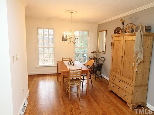 1605 Westhaven Drive Raleigh, NC 27607 - Photo 6 of 23 a view of a dining room with furniture and wooden floor