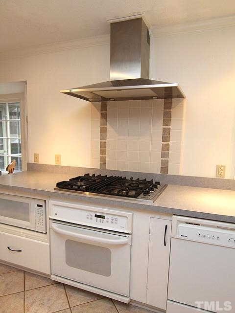 1605 Westhaven Drive Raleigh, NC 27607 - Photo 8 of 23 a stove top oven sitting inside of a kitchen