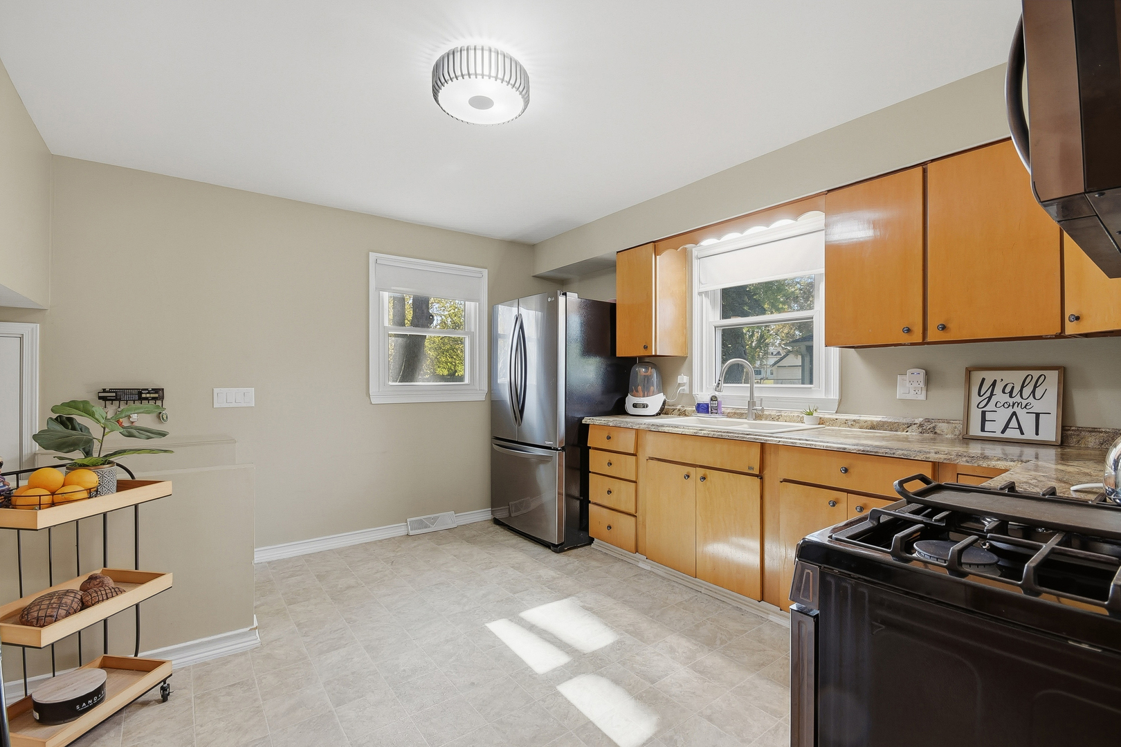 5155 West Main Street Monee, IL 60449 - Photo 11 of 19 a kitchen with a stove a sink and a refrigerator