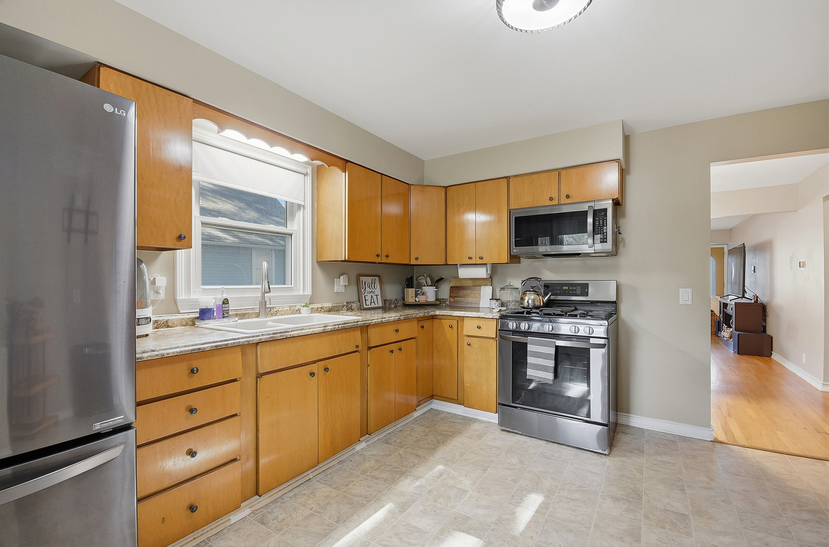 5155 West Main Street Monee, IL 60449 - Photo 12 of 19 a kitchen with stainless steel appliances granite countertop a stove top oven a sink dishwasher a refrigerator and a microwave oven