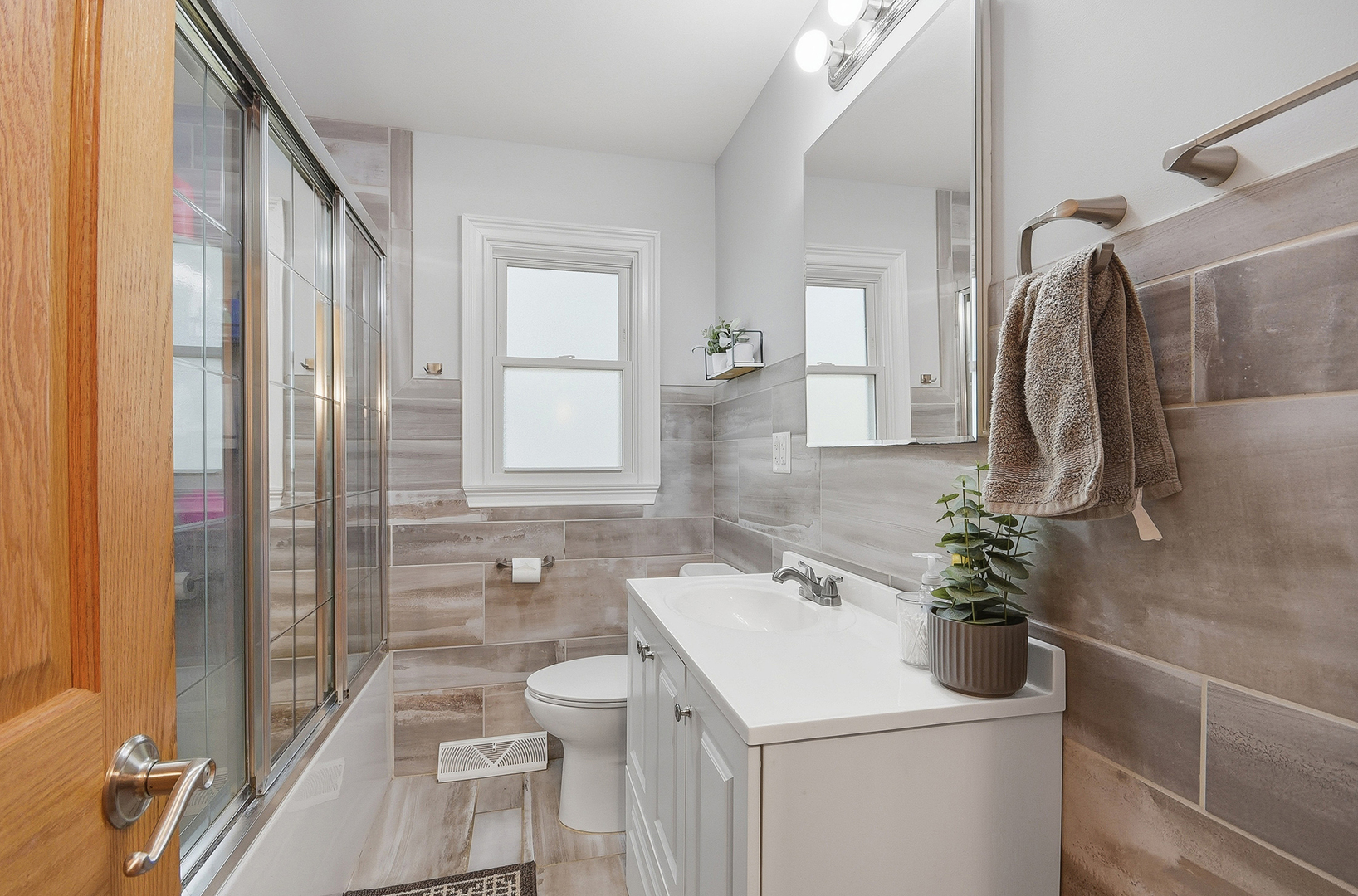 5155 West Main Street Monee, IL 60449 - Photo 13 of 19 a bathroom with a sink a toilet and shower
