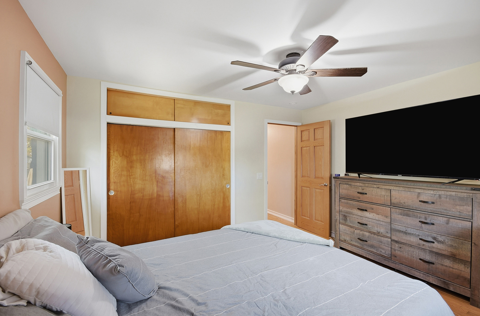 5155 West Main Street Monee, IL 60449 - Photo 15 of 19 a bedroom with a bed a television and a dresser