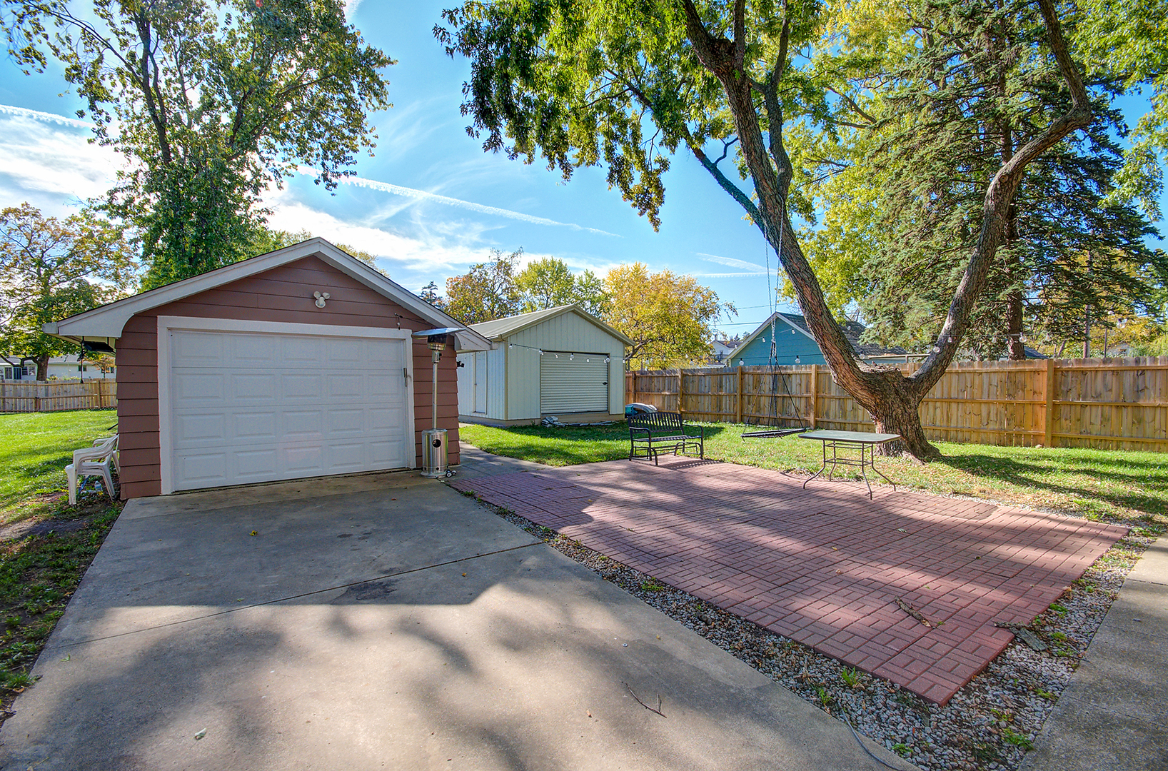 5155 West Main Street Monee, IL 60449 - Photo 7 of 19 a front view of a house with a garden and tree