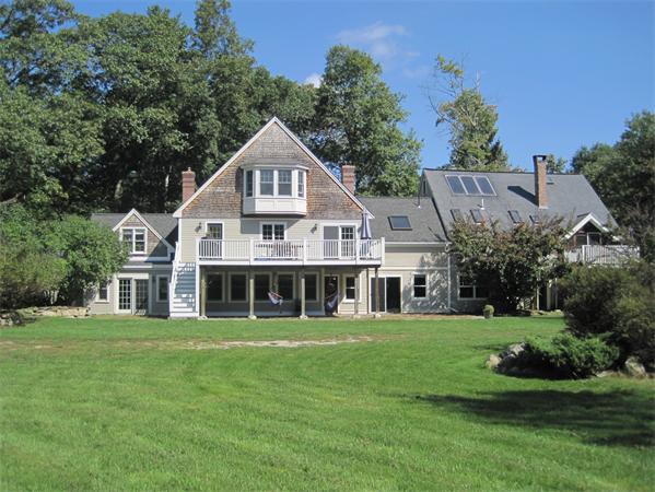 76 Taylor Road Stow, MA 01775 - Photo 1 of 27 a front view of a house with a yard