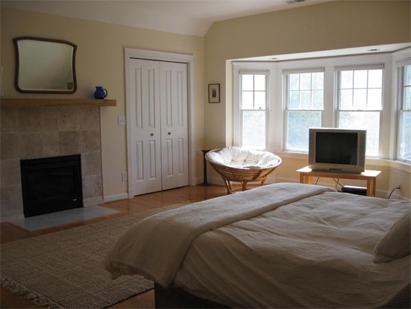 76 Taylor Road Stow, MA 01775 - Photo 12 of 27 a bedroom with a bed and a television