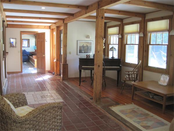 76 Taylor Road Stow, MA 01775 - Photo 15 of 27 a living room with furniture rug and wooden floor