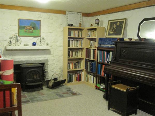 76 Taylor Road Stow, MA 01775 - Photo 19 of 27 a living room with furniture and a fireplace
