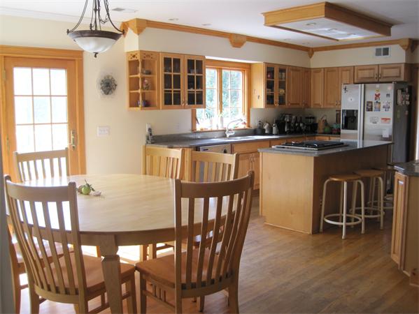 76 Taylor Road Stow, MA 01775 - Photo 3 of 27 a kitchen with a dining table chairs and large window