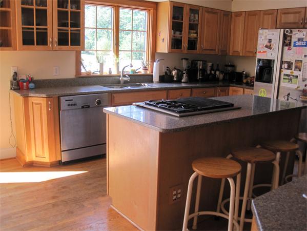 76 Taylor Road Stow, MA 01775 - Photo 4 of 27 a kitchen with stainless steel appliances granite countertop a stove a sink and a microwave