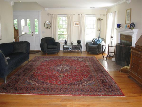 76 Taylor Road Stow, MA 01775 - Photo 8 of 27 a living room with fireplace furniture and a rug