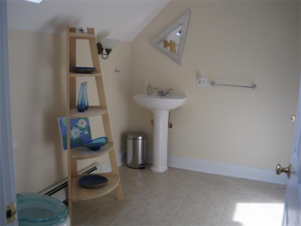 76 Taylor Road Stow, MA 01775 - Photo 9 of 27 a bathroom with a sink and mirror