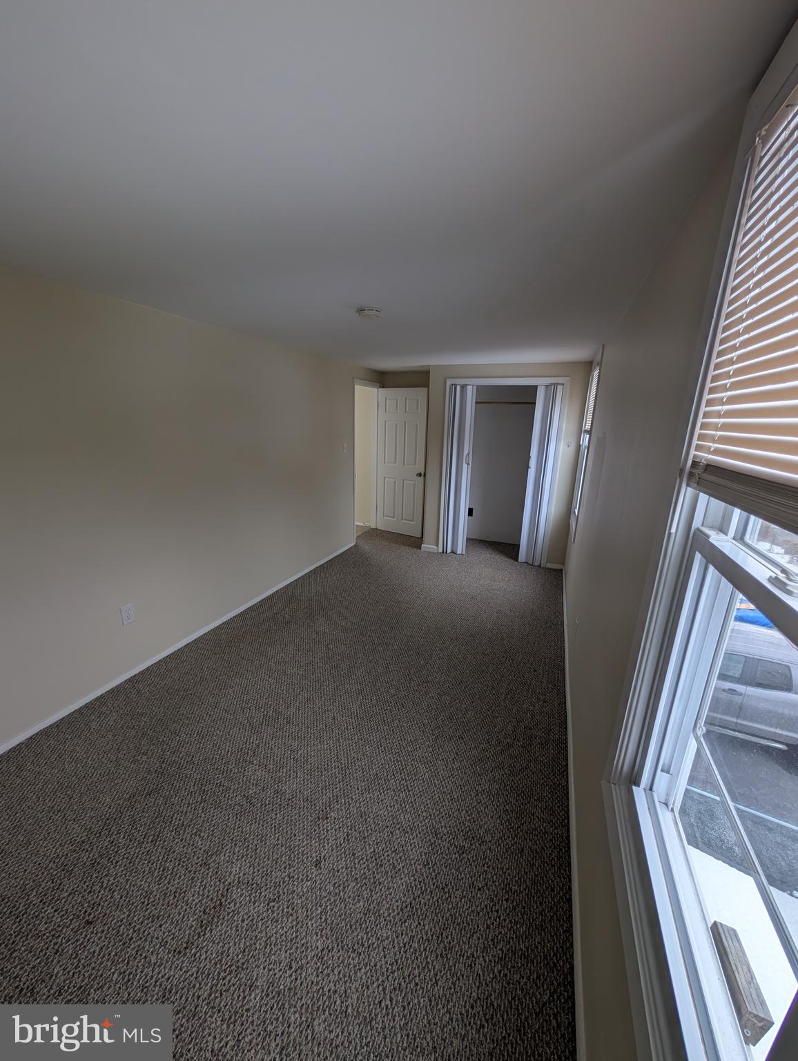 30 West Roland Road Brookhaven, PA 19015 - Photo 13 of 17 a view of an empty room and wooden floor