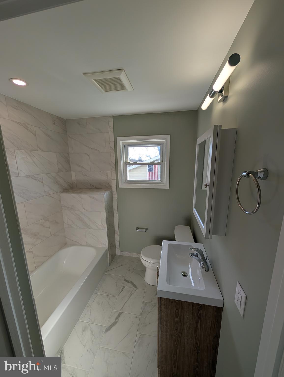 30 West Roland Road Brookhaven, PA 19015 - Photo 9 of 17 a bathroom with a sink toilet and shower