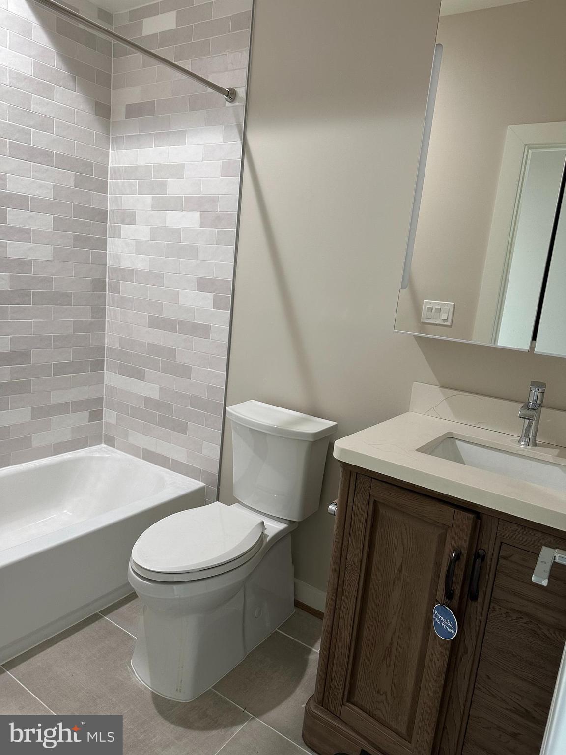 234 15th Street Northeast Washington, DC 20002 - Photo 12 of 15 a white toilet sitting next to a bath tub